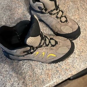 Tan and black men’s Merrill boots, waterproof size 8 1/2 wide